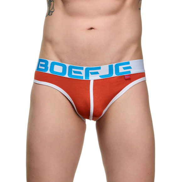 Оранжевые мужские трусы-слипы с провокационной надписью на задней части Оранжевые мужские трусы-слипы с провокационной надписью на задней части