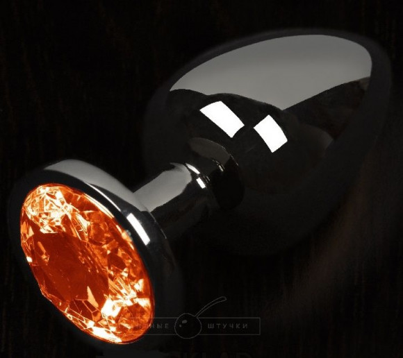 Графитовая анальная пробка с оранжевым кристаллом - 6 см. Графитовая анальная пробка с оранжевым кристаллом - 6 см.