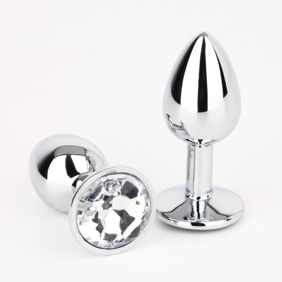 Серебристая анальная втулочка с прозрачным кристаллом - 7 см. Серебристая анальная втулочка с прозрачным кристаллом - 7 см.