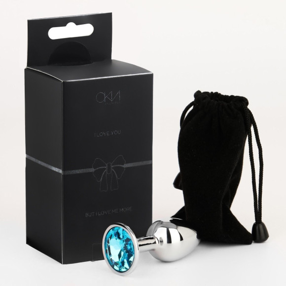 Серебристая анальная втулочка с голубым кристаллом - 7 см. Серебристая анальная втулочка с голубым кристаллом - 7 см.